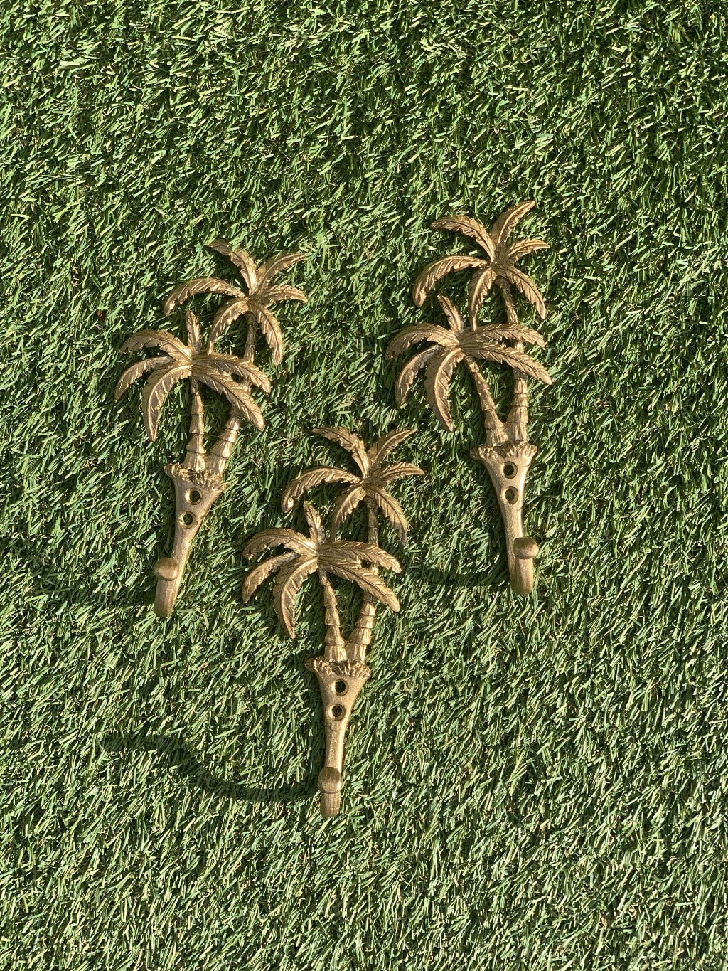 Our Islander Palm Tree Wall Hook has two brass swaying palm trees and a single hook. This little beauty is great to hang your keys, hat or towels. Our Islander Palm Tree Wall Hook comes with screws ready to hang. Add a touch of the tropics to your decor.| Bliss Gifts &amp; Homewares | Unit 8, 259 Princes Hwy Ulladulla | South Coast NSW | Online Retail Gift &amp; Homeware Shopping | 0427795959, 44541523