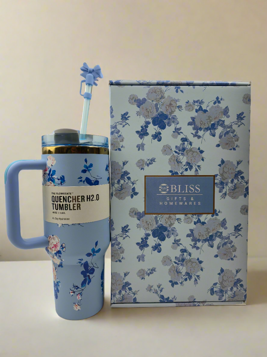 Four floral-themed tumblers with handles 