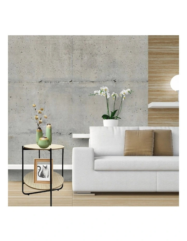Round lightwood side table with storage shelf
