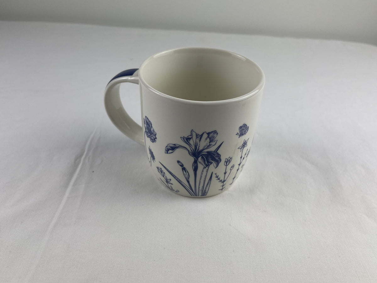 Lightweight bone china floral mug with a glossy white finish.