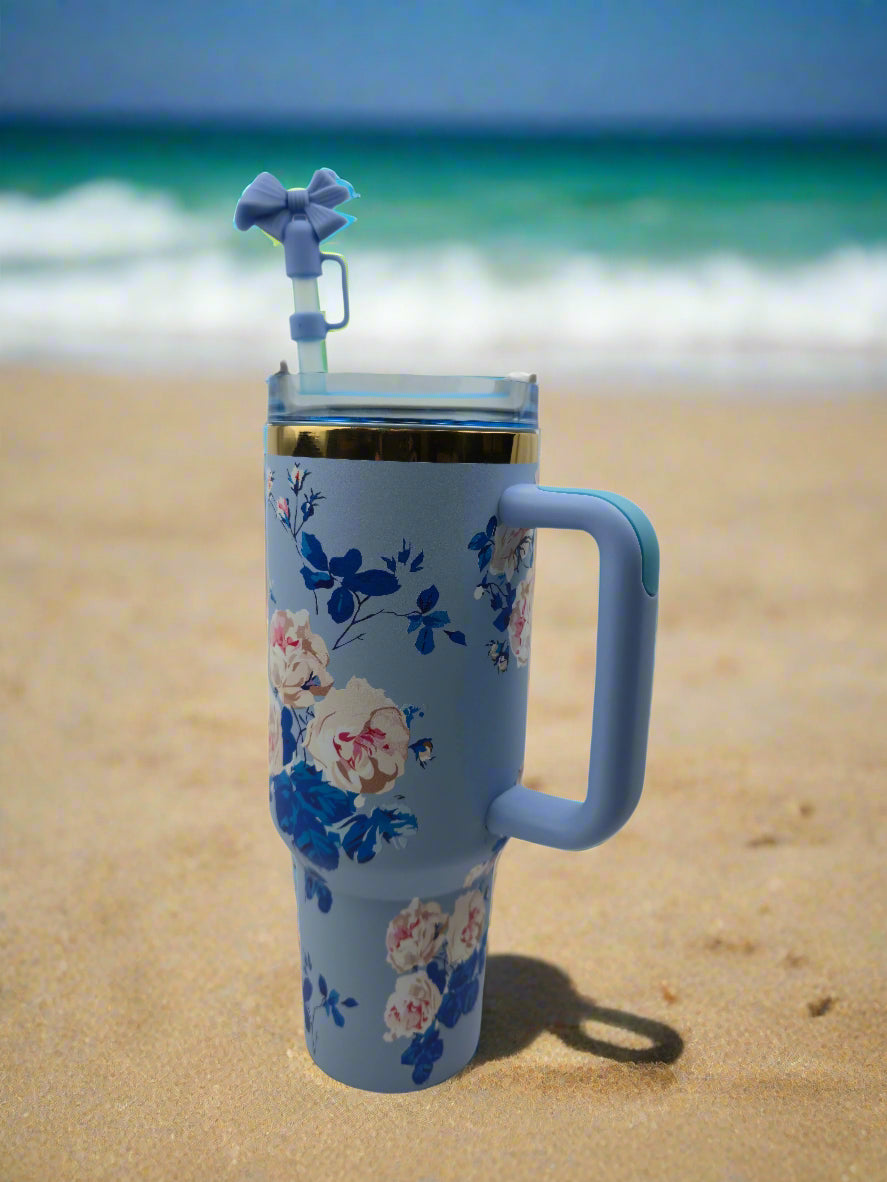 Floral-patterned tumbler with a handle 