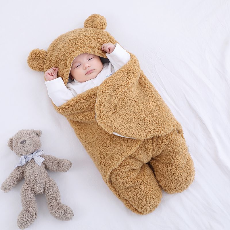 Baby wrap blanket, brown, designed for infant comfort.