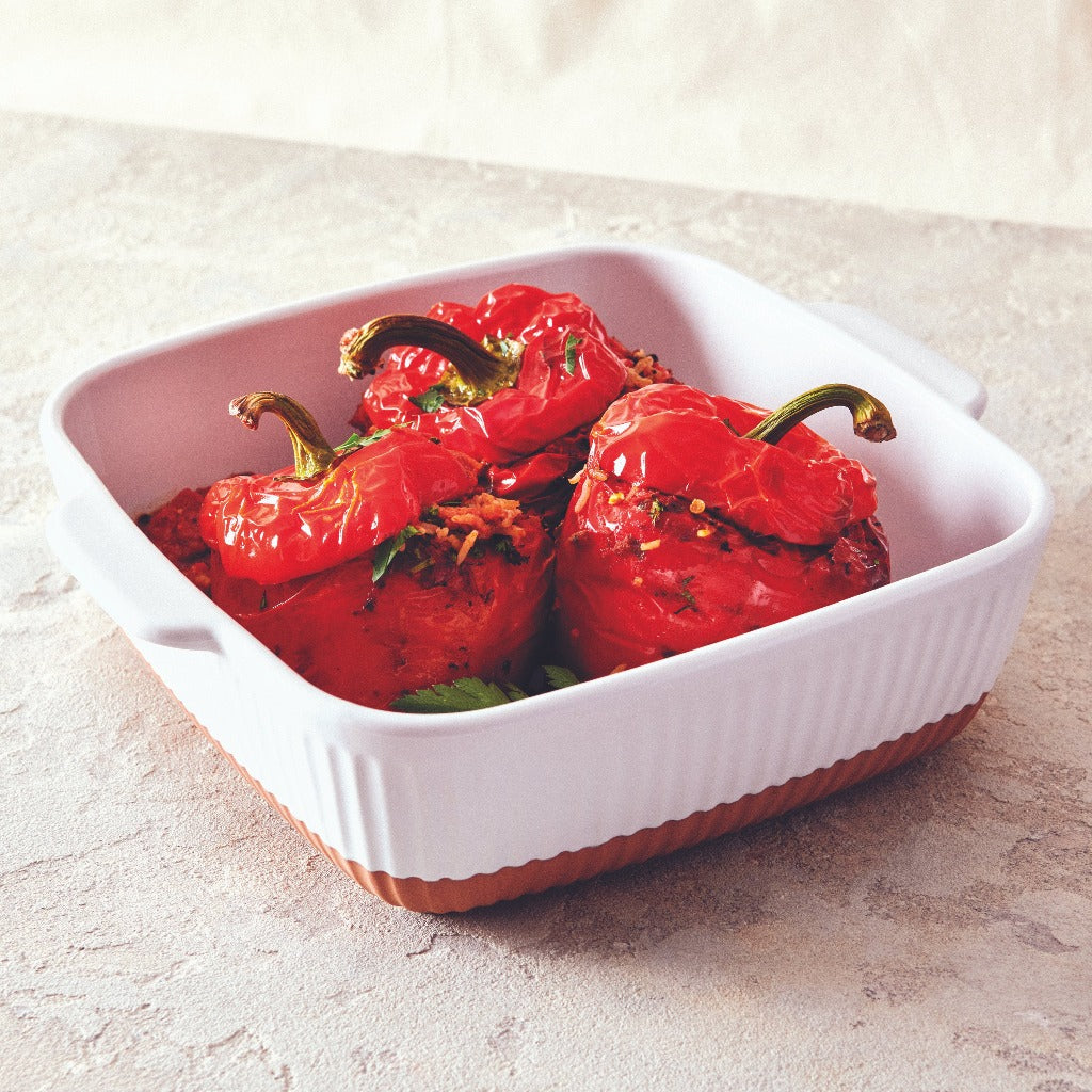 Created from stoneware with a soft organic form and hand carved rib texture is our Amana Square Baking Dish. A distinctive glossy white glaze and matte faux terracotta base, this 24.5x8cm baking dish is perfect for entertaining.| Bliss Gifts & Homewares | Unit 8, 259 Princes Hwy Ulladulla | South Coast NSW | Online Retail Gift & Homeware Shopping | 0427795959, 44541523