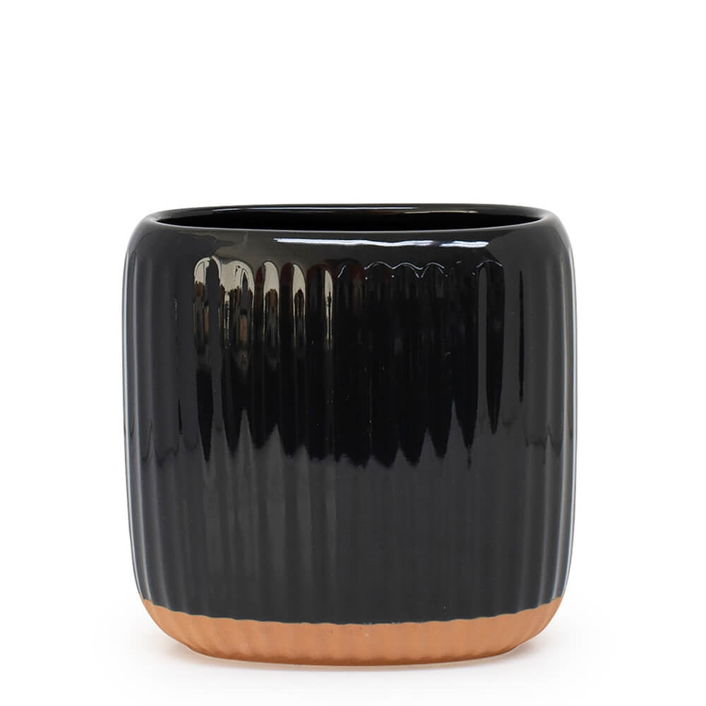 Created from stoneware with a soft organic form and hand carved rib texture is our Amana Utensil Holder. With a distinctive glossy black glaze and matte faux terracotta base, this 16.5x11x16cm utensil holder is ideal for keeping your bench top tidy.| Bliss Gifts & Homewares | Unit 8, 259 Princes Hwy Ulladulla | South Coast NSW | Online Retail Gift & Homeware Shopping | 0427795959, 44541523