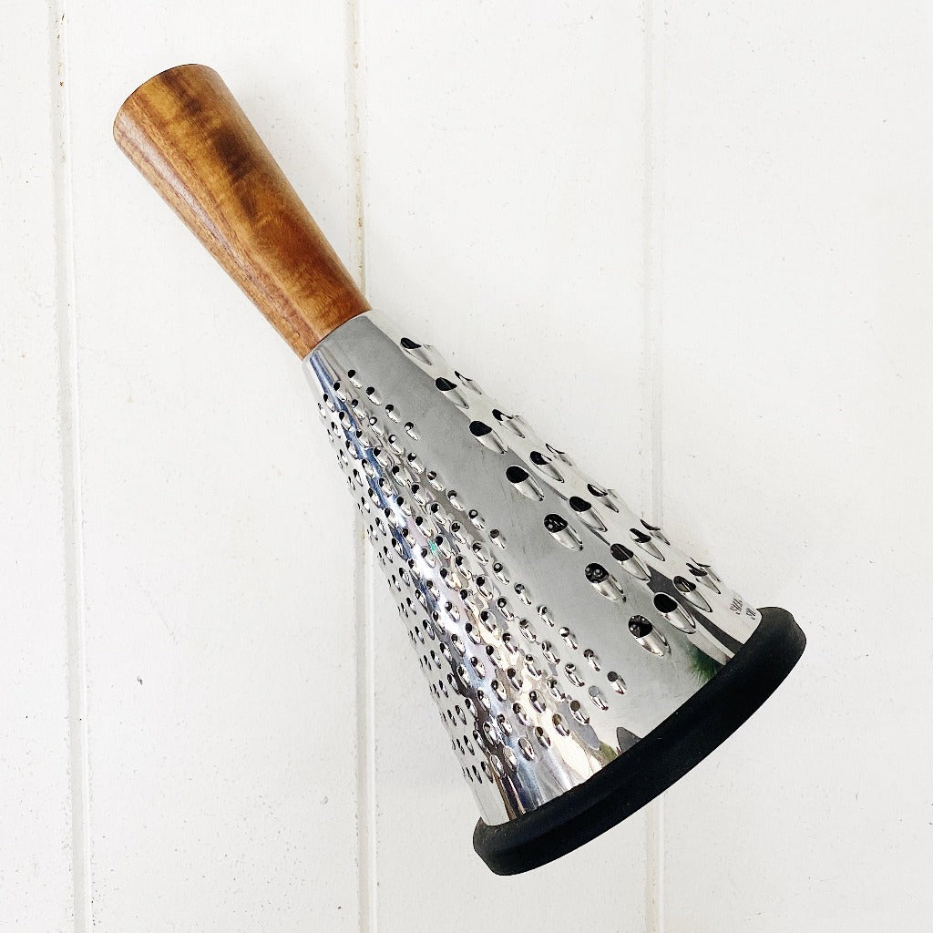 Make a statement in your kitchen with our Acacia and Stainless Steel Grater. A high quality Stainless Steel Grater that is both functional and beautiful with an Acacia wood handle. Non slip silicone base. 26cm. Shop online.  | Bliss Gifts &amp; Homewares | Unit 8, 259 Princes Hwy Ulladulla | South Coast NSW | Online Retail Gift &amp; Homeware Shopping | 0427795959, 44541523