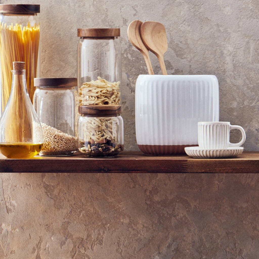 Created from stoneware with a soft organic form and hand carved rib texture is our Amana Utensil Holder. With a distinctive glossy white glaze and matte faux terracotta base, this 16.5x11.16cm utensil holder is ideal for keeping your bench top tidy.| Bliss Gifts &amp; Homewares | Unit 8, 259 Princes Hwy Ulladulla | South Coast NSW | Online Retail Gift &amp; Homeware Shopping | 0427795959, 44541523