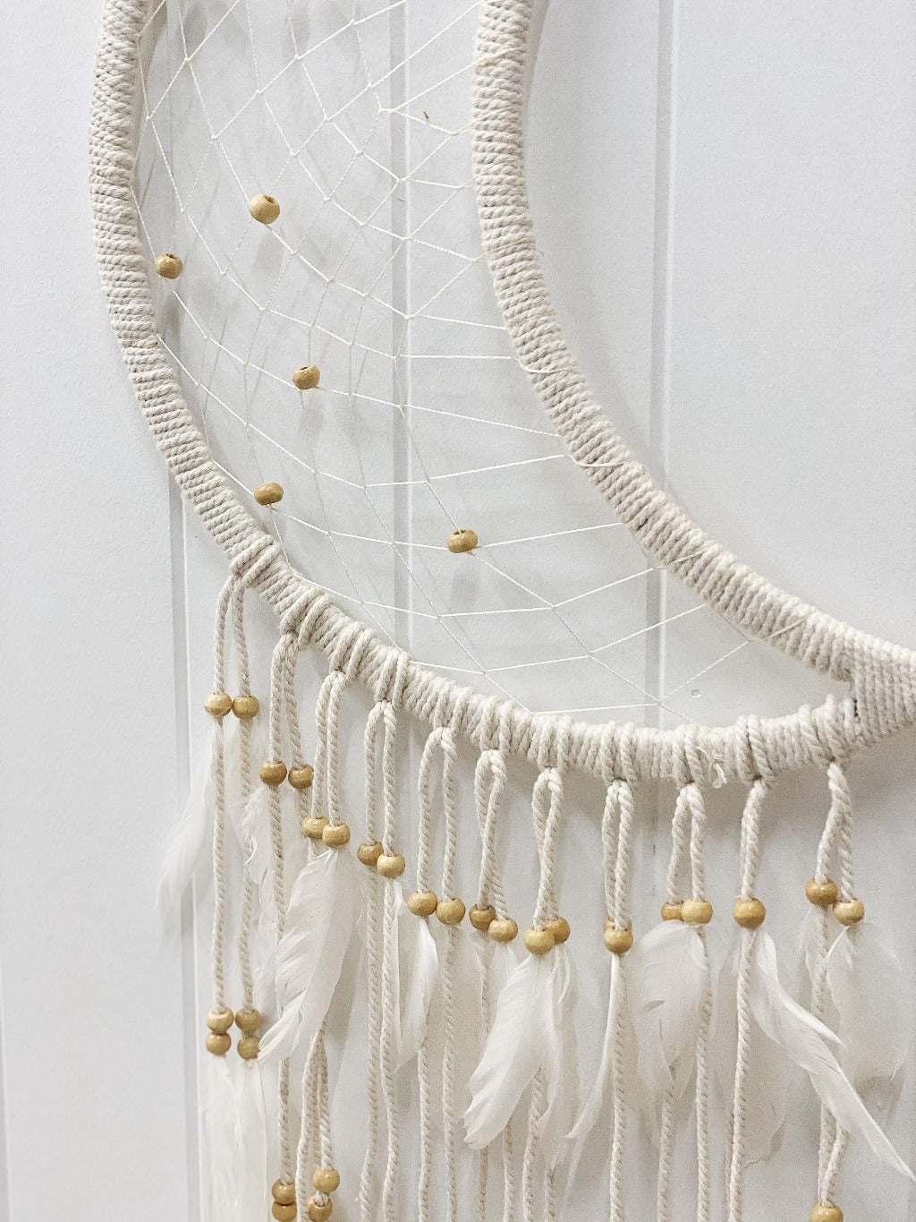 Encourage peaceful nights by placing our beautiful Beaded Moon Dream Catcher in a nursery or child&#39;s room, or even just to add some bohemian style to your home. Features beaded tassels and beaded weave in the moon shape. Hangs 97cm.| Bliss Gifts &amp; Homewares | Unit 8, 259 Princes Hwy Ulladulla | South Coast NSW | Online Retail Gift &amp; Homeware Shopping | 0427795959, 44541523