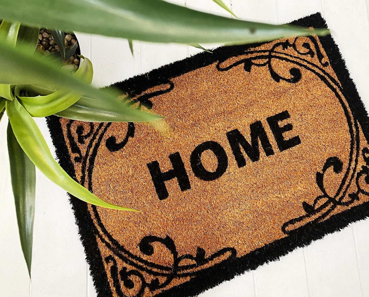 Our gorgeous Filigree Home Door Mat is the perfect way to create a luxe feel to your home before your guests even step foot inside. - 60 x 40cm - Black &quot;Home&quot; sign surrounded by a beautiful black filigree design on a natural background - Made from Natural coir fibres - PVC backing | Bliss Gifts &amp; Homewares | Unit 8, 259 Princes Hwy Ulladulla | South Coast NSW | Online Retail Gift &amp; Homeware Shopping | 0427795959, 44541523