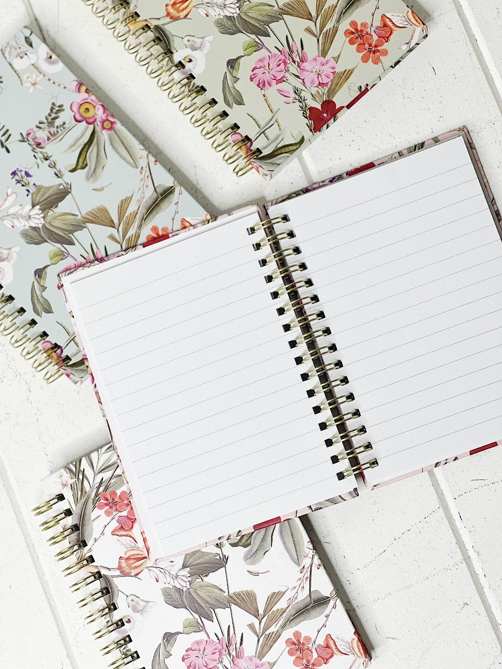 These gorgeous Floral Deluxe Spiral Notebook - A6 are a perfect gift for your loved ones or for yourself, if you love to handwrite your notes. Each notebook features a unique background colour with gorgeous gold foiled flowers on the front. 80 sheets.| Bliss Gifts &amp; Homewares | Unit 8, 259 Princes Hwy Ulladulla | South Coast NSW | Online Retail Gift &amp; Homeware Shopping | 0427795959, 44541523