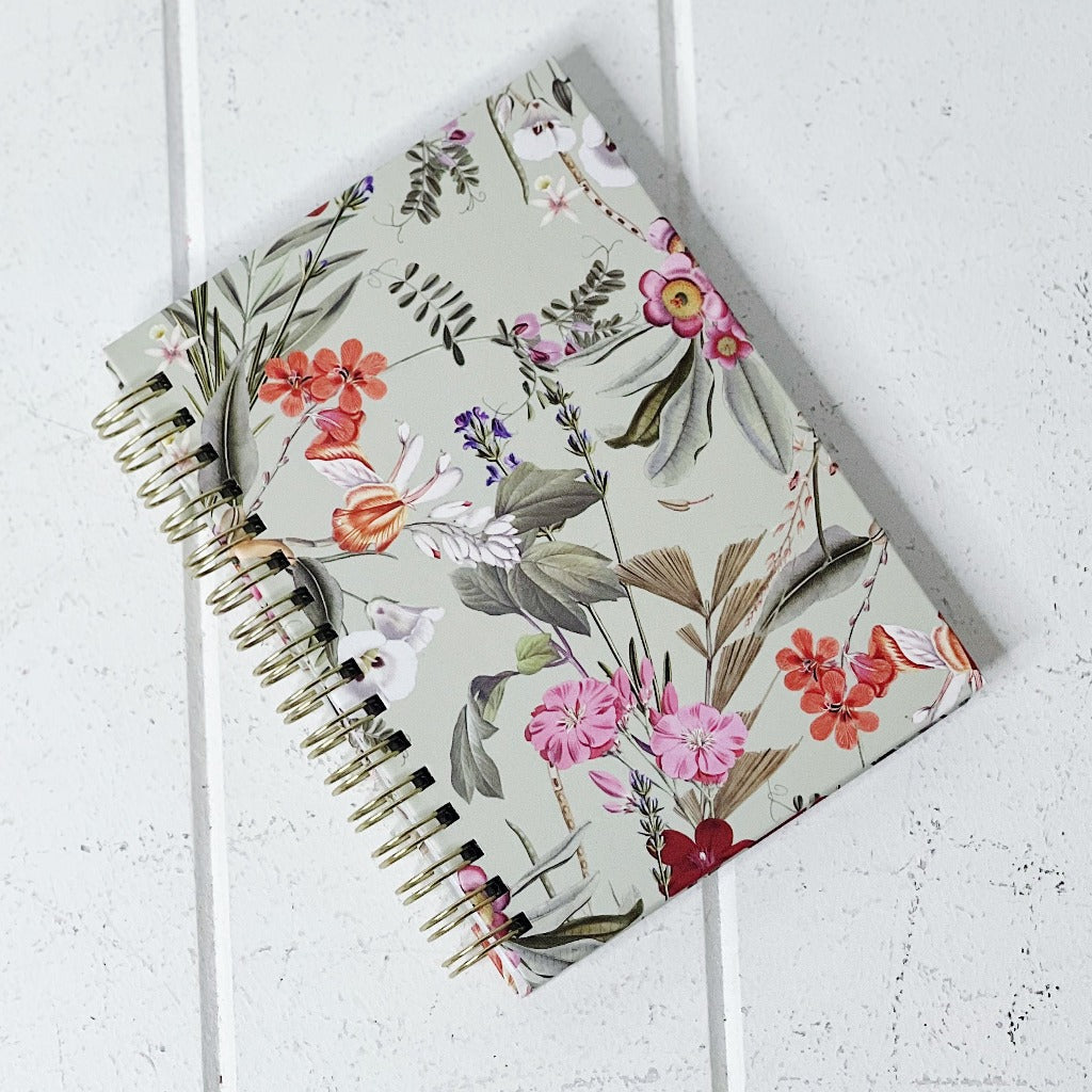 These gorgeous Floral Deluxe Spiral Notebook - A6 are a perfect gift for your loved ones or for yourself, if you love to handwrite your notes. Each notebook features a unique background colour with gorgeous gold foiled flowers on the front. 80 sheets.| Bliss Gifts &amp; Homewares | Unit 8, 259 Princes Hwy Ulladulla | South Coast NSW | Online Retail Gift &amp; Homeware Shopping | 0427795959, 44541523
