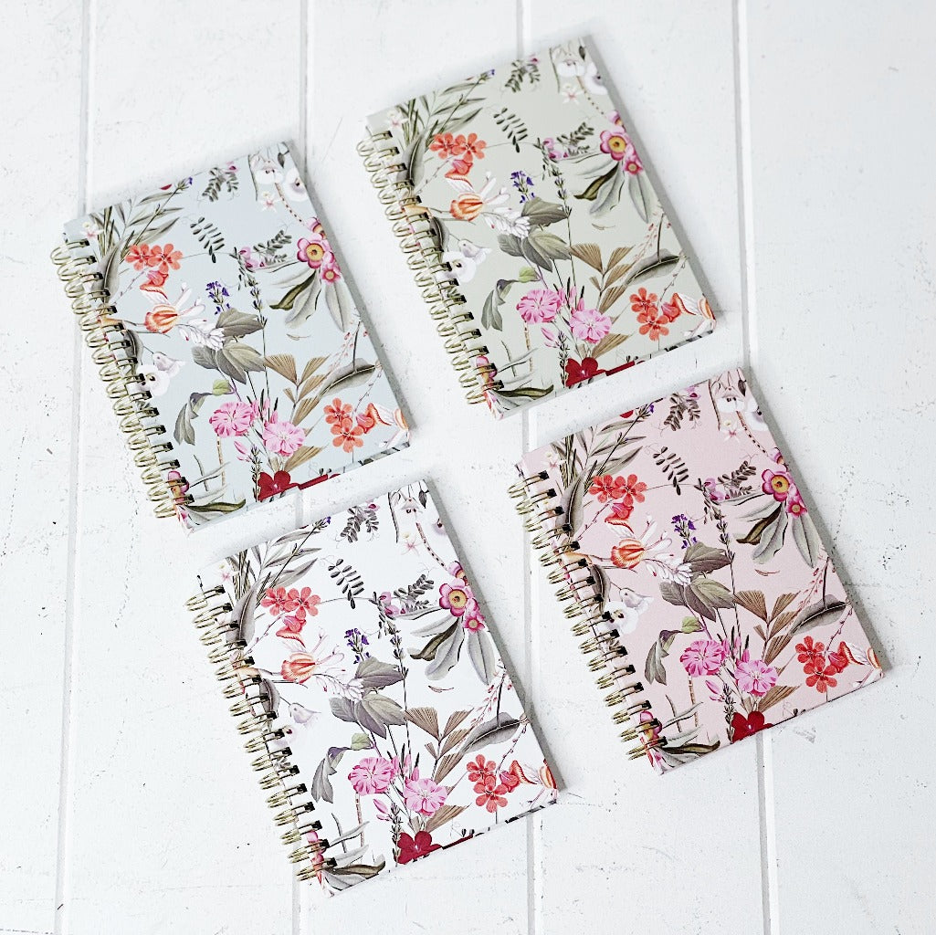 These gorgeous Floral Deluxe Spiral Notebook - A6 are a perfect gift for your loved ones or for yourself, if you love to handwrite your notes. Each notebook features a unique background colour with gorgeous gold foiled flowers on the front. 80 sheets.| Bliss Gifts &amp; Homewares | Unit 8, 259 Princes Hwy Ulladulla | South Coast NSW | Online Retail Gift &amp; Homeware Shopping | 0427795959, 44541523