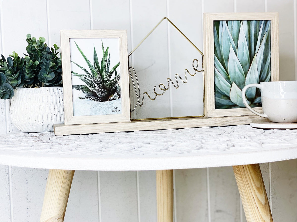 If a picture is worth a thousand words, then the meaning of this Home Twin Standing Photo Frame is abundantly clear! This frame combines the word &quot;Home&quot; in attractive, metal in between your chosen images. Entire frame: 46x7x22cm.| Bliss Gifts &amp; Homewares | Unit 8, 259 Princes Hwy Ulladulla | South Coast NSW | Online Retail Gift &amp; Homeware Shopping | 0427795959, 44541523