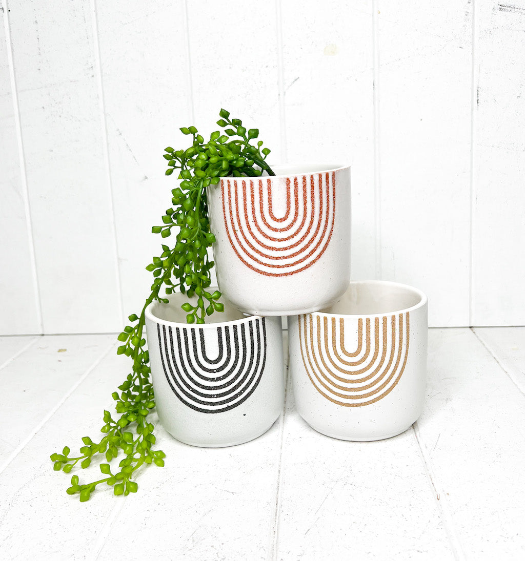 Our Macy Speckled Arch Ceramic Pots are the perfect vessel for your favourite plants. A great ceramic pot that can also be used as a pen holder, utensil holder or as a dried flower vase. 3 colours. Textured. 10.3 x 10CMH. | Bliss Gifts &amp; Homewares | Unit 8, 259 Princes Hwy Ulladulla | South Coast NSW | Online Retail Gift &amp; Homeware Shopping | 0427795959, 44541523