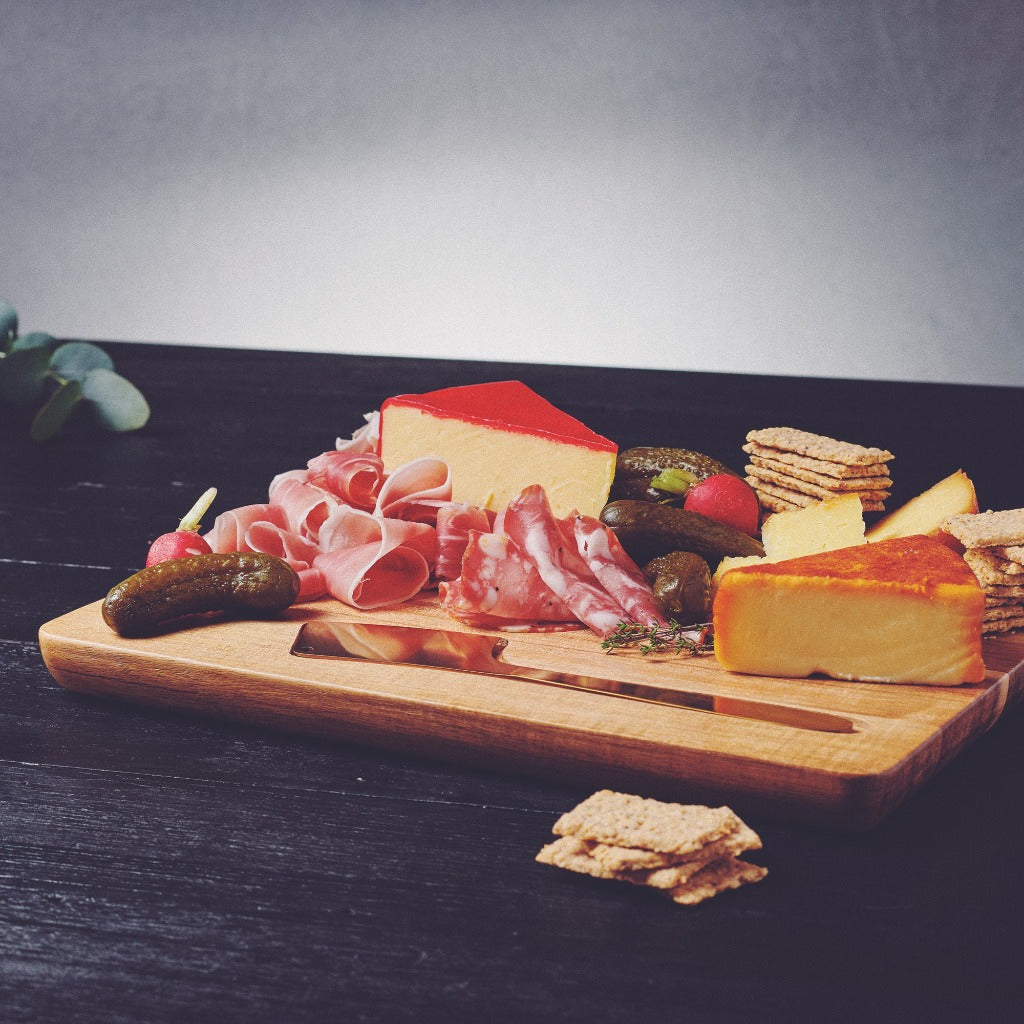 Elevate that sneaky after-work cheese and bickies with our Provedore serving board with cheese knife. Made from classic Acacia wood and complete with a gold cheese knife, our Provedore oval serving board makes any spread feel just a little bit more indulgent.| Bliss Gifts &amp; Homewares | Unit 8, 259 Princes Hwy Ulladulla | South Coast NSW | Online Retail Gift &amp; Homeware Shopping | 0427795959, 44541523