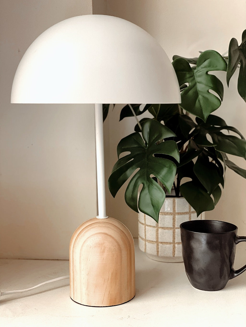 The Rocca Table Lamp is lighting to put you in the mood. With a natural wood base and white metal shade, this 40x46cm table lamp is all about creating an atmosphere to suit your room. Get your mood right with the Rocca Table Lamp.| Bliss Gifts &amp; Homewares | Unit 8, 259 Princes Hwy Ulladulla | South Coast NSW | Online Retail Gift &amp; Homeware Shopping | 0427795959, 44541523