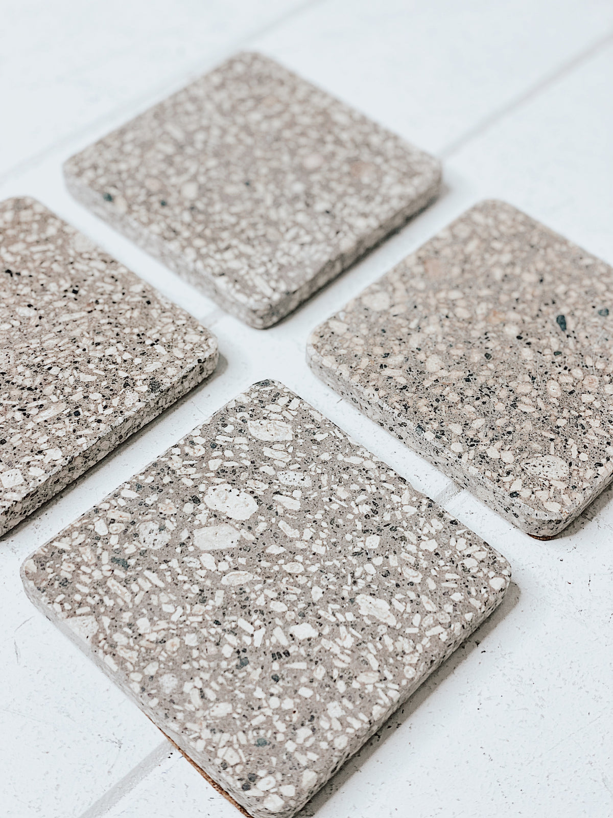Complete your home in style with our on trend Terrazzo Grey Coasters in a Set of 4. This sleek design and matte finish will spruce up your dining table. Place on your coffee table or add a luxe touch to your next dinner party. Measures: 10x10cm.