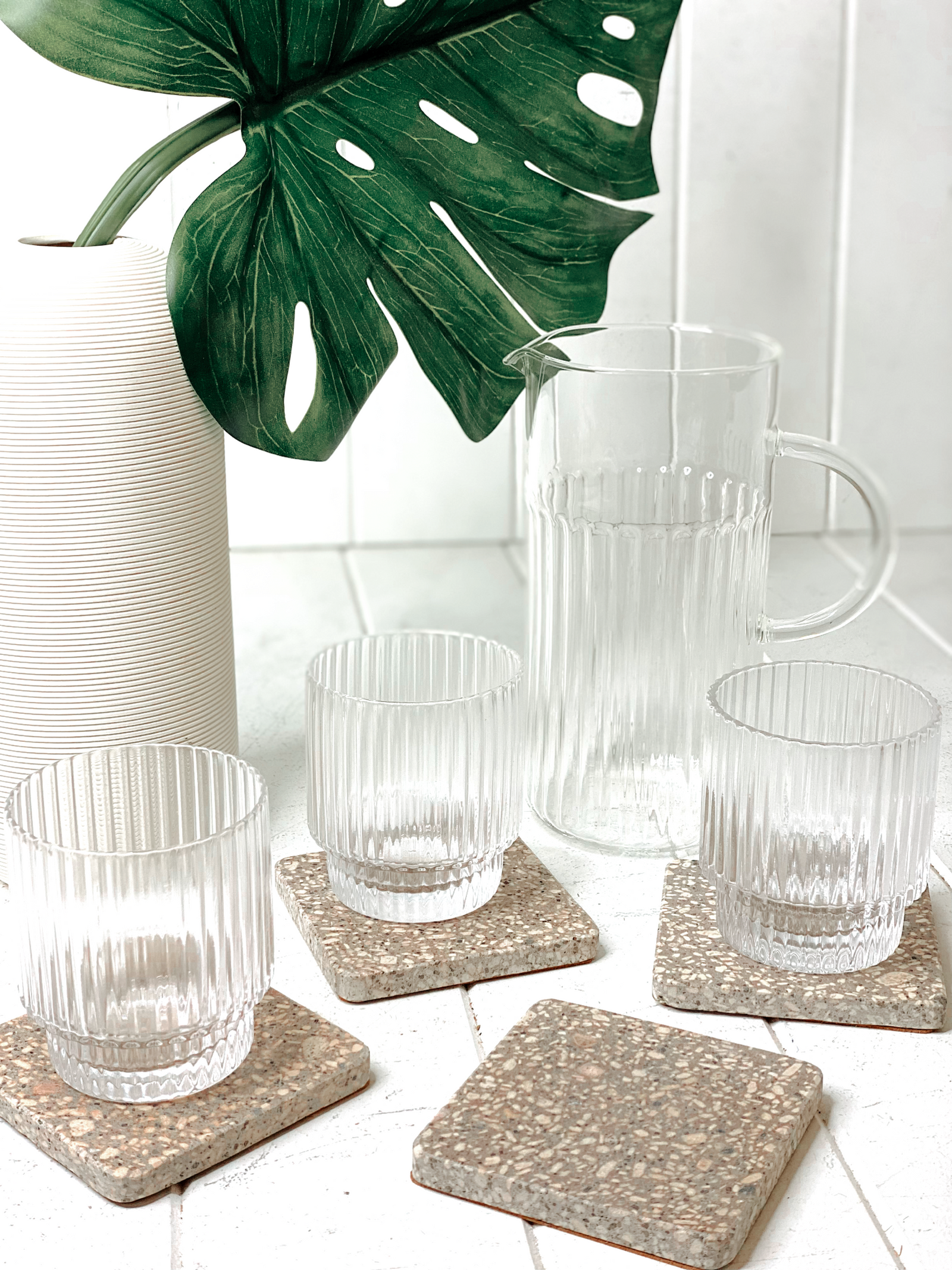 Complete your home in style with our on trend Terrazzo Grey Coasters in a Set of 4. This sleek design and matte finish will spruce up your dining table. Place on your coffee table or add a luxe touch to your next dinner party. Measures: 10x10cm.