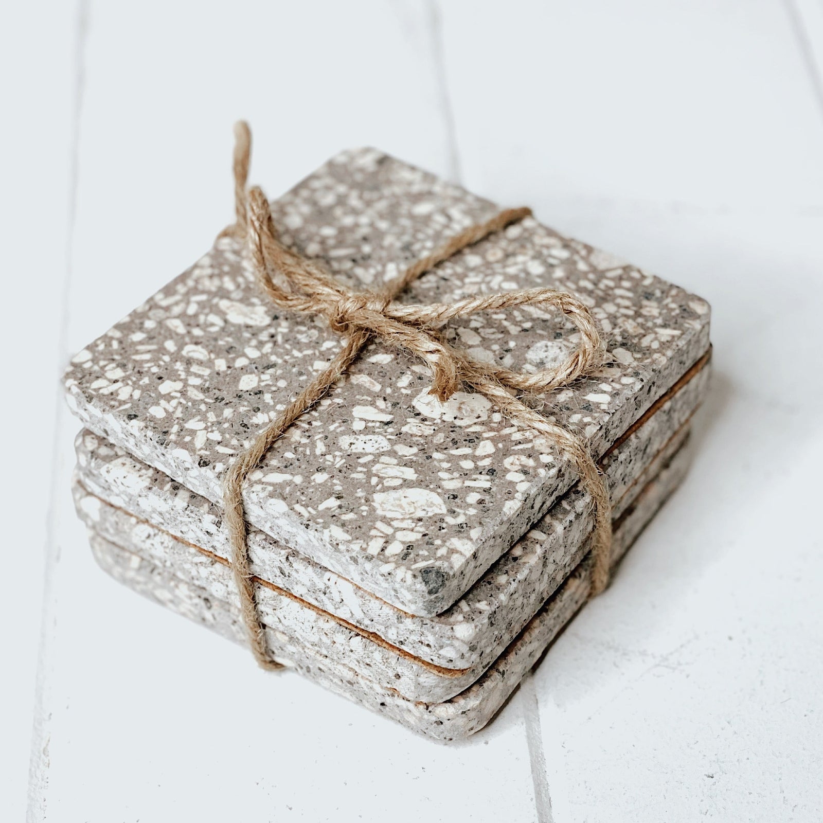 Complete your home in style with our on trend Terrazzo Grey Coasters in a Set of 4. This sleek design and matte finish will spruce up your dining table. Place on your coffee table or add a luxe touch to your next dinner party. Measures: 10x10cm.