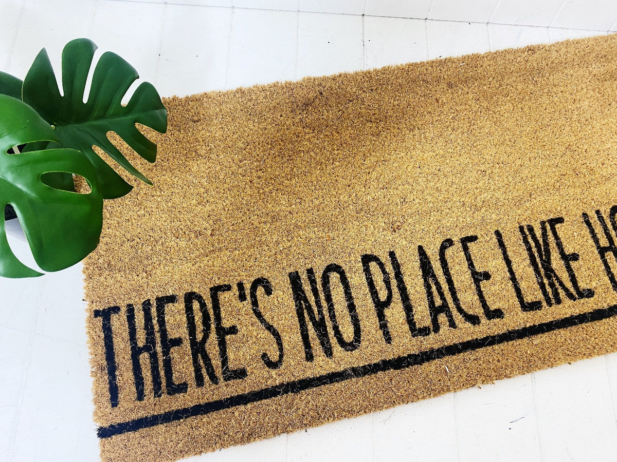 Our new There&#39;s No Place Like Home Door Mat - Wide is perfect for large doorways and to create a welcome feel to your home before your guests even step foot inside. Made from Natural coir fibres. PVC backing. Extra wide design - 90x45x1.5cm.| Bliss Gifts &amp; Homewares | Unit 8, 259 Princes Hwy Ulladulla | South Coast NSW | Online Retail Gift &amp; Homeware Shopping | 0427795959, 44541523