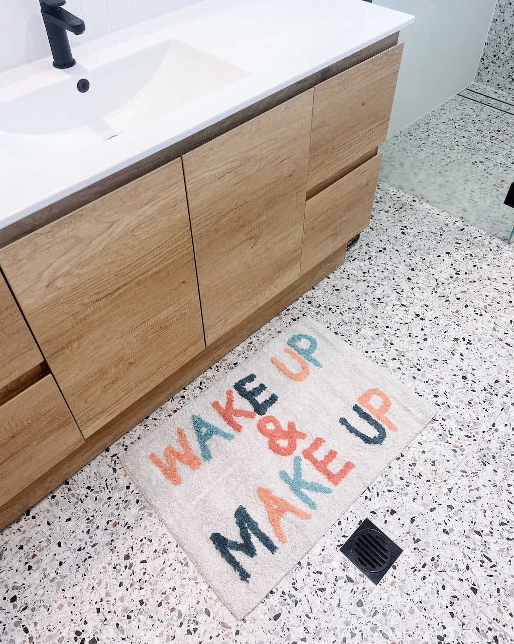 Wake Up & Make Up Bathmat - 50 x 80cm will bring a playful style and a pop of colour to your bathroom. Featuring a fun worded design, this bathmat also adds texture to your bathroom or ensuite.| Bliss Gifts & Homewares | Unit 8, 259 Princes Hwy Ulladulla | South Coast NSW | Online Retail Gift & Homeware Shopping | 0427795959, 44541523