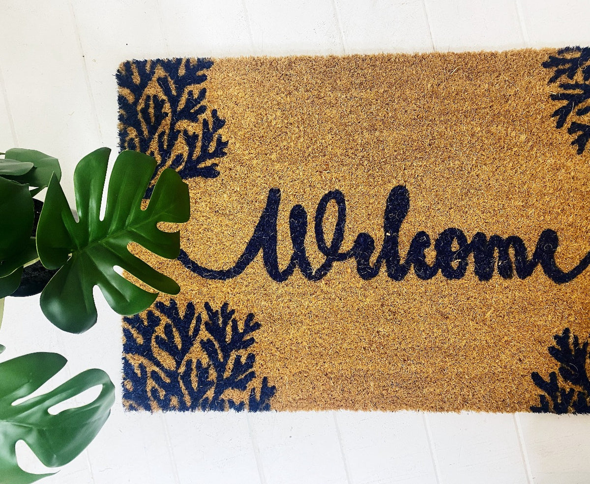 Welcome guests to your home with splash of coastal flair by laying out this fun, Welcome Coral Door Mat. Made from Natural coir fibres. PVC backing. Measures: 40x60x1.5cm.| Bliss Gifts &amp; Homewares | Unit 8, 259 Princes Hwy Ulladulla | South Coast NSW | Online Retail Gift &amp; Homeware Shopping | 0427795959, 44541523