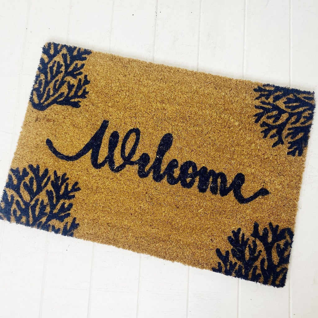 Welcome guests to your home with splash of coastal flair by laying out this fun, Welcome Coral Door Mat. Made from Natural coir fibres. PVC backing. Measures: 40x60x1.5cm.| Bliss Gifts &amp; Homewares | Unit 8, 259 Princes Hwy Ulladulla | South Coast NSW | Online Retail Gift &amp; Homeware Shopping | 0427795959, 44541523