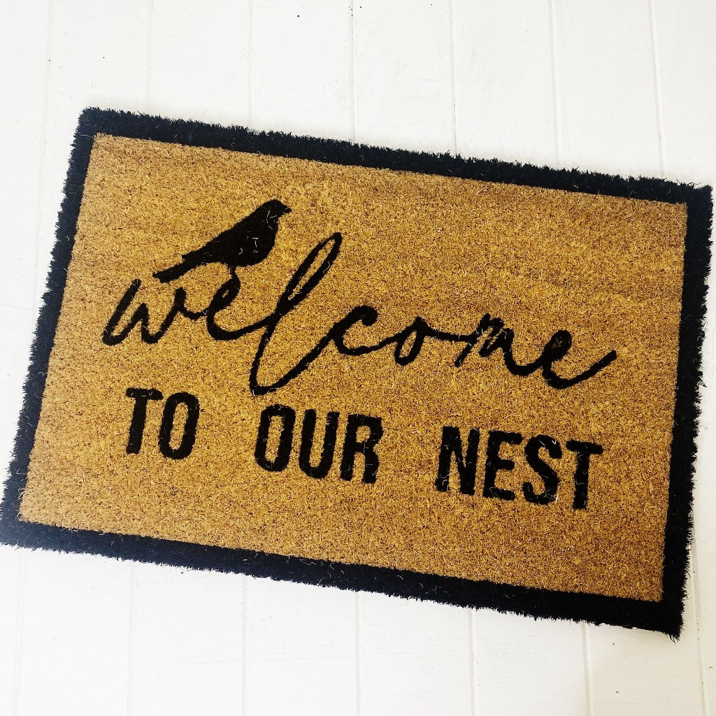 Our Welcome To Our Nest Door Mat is the perfect way to create a welcoming feel to your home before your guests even step foot inside with its beautiful design. Made from Natural coir fibres. PVC backing. Measures: 40x60x1.5cm.| Bliss Gifts &amp; Homewares | Unit 8, 259 Princes Hwy Ulladulla | South Coast NSW | Online Retail Gift &amp; Homeware Shopping | 0427795959, 44541523