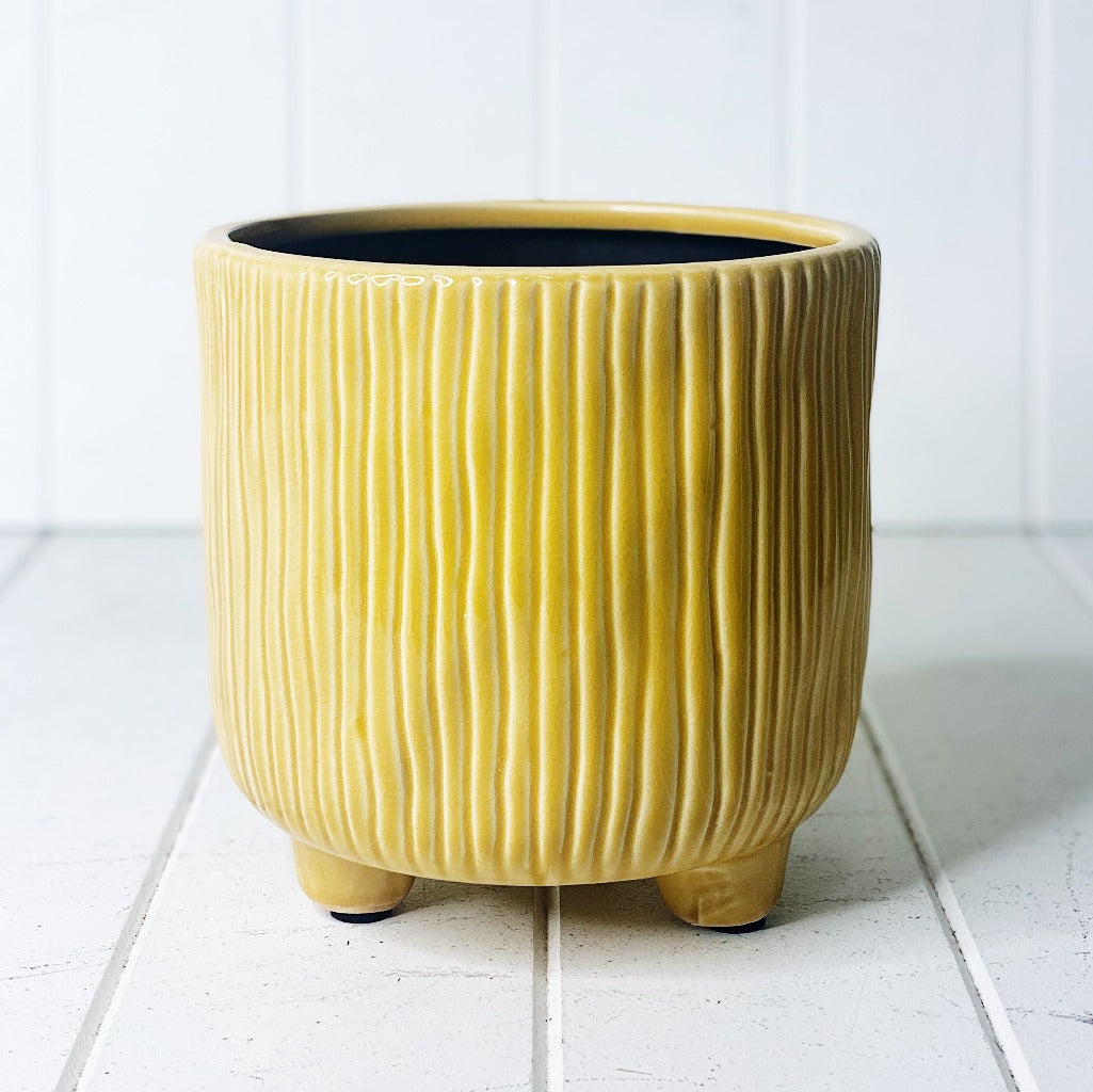 Display your favourite floral accents with our beautiful Winnie Ceramic Pot with Feet. The bright mustard tone will suit any decor, while the ribbed pattern adds texture to any space. 16.5 x 17cm.| Bliss Gifts &amp; Homewares | Unit 8, 259 Princes Hwy Ulladulla | South Coast NSW | Online Retail Gift &amp; Homeware Shopping | 0427795959, 44541523