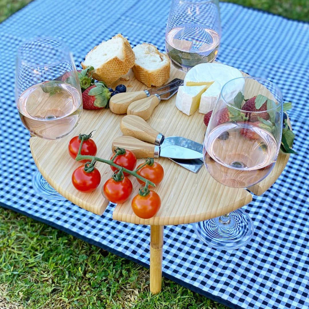 Made from lightweight bamboo, this circular tray includes four stainless steel cheese knives, screw legs in two heights and six openings to safeguard your wine-stemmed glasses – with room for fine cheeses in the middle. BLISS Gifts &amp; Homewares - Online &amp; In-store. AfterPay now available.| Bliss Gifts &amp; Homewares | Unit 8, 259 Princes Hwy Ulladulla | South Coast NSW | Online Retail Gift &amp; Homeware Shopping | 0427795959, 44541523